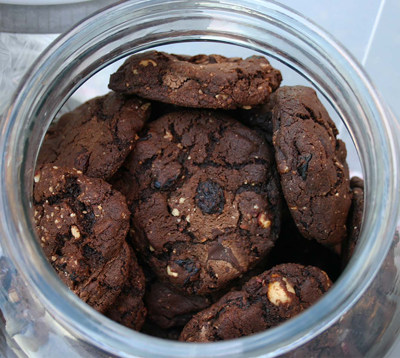 chocolate cookies in a clear glass cookie jar